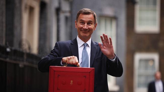 UK Chancellor Jeremy Hunt leaves Downing Street with the despatch box to present his spring budget to parliament on March 15, 2023 in London.