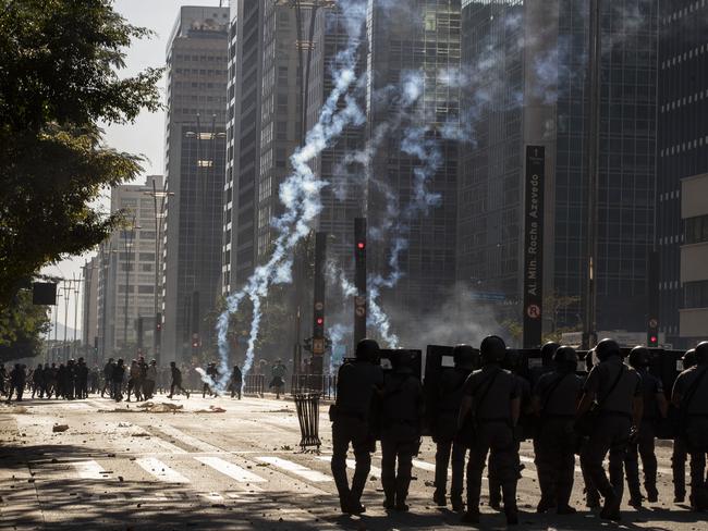 Police clash with anti-government demonstrators in Sao Paulo, Brazil, on Sunday. Picture: AP