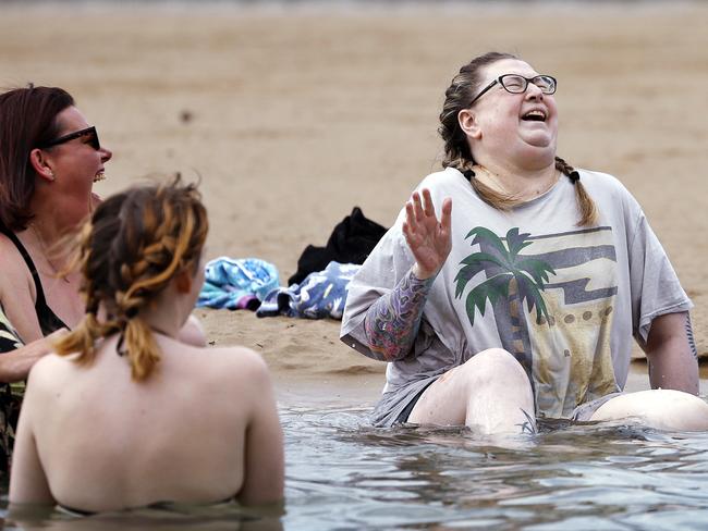 WARNING - EMBARGOED FOR THE WEEKEND TELEGRAPH - DO NOT USE WITHOUT SPEAKING TO THE PICTURE DESK., Kay Henderson (middle in T-Shirt) pictured with family and friends going for a final swim at Coffs Harbour before she passes away using the Voluntary Assisted Dying (VAD ) program tomorrow. Picture: Sam Ruttyn