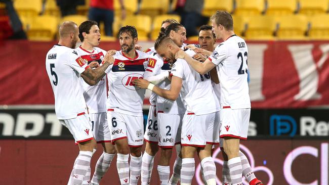 Ken Ilso Adelaide United celebrates with teammates after scoring a goal against the Wellington Phoenix. Picture: Getty Images
