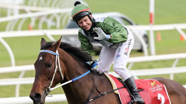 Brett Prebble returns to the mounting yard aboard Incentivise after winning the 2021 Caulfield Cup.