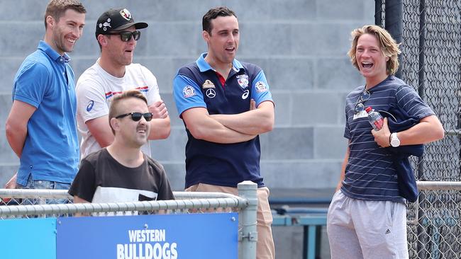 Cody Weightman gets shown around the Whitten Oval by Western Bulldogs list manager Sam Power and National Recruiting Manager Nick Austin. Pic: Michael Klein