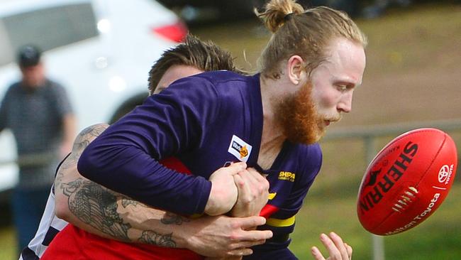 RDFL footy: Diggers Rest V Macedon. Stephen Ruane for Diggers Rest tackled by Macedon's Jason Cooke.