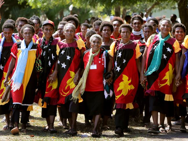 Papua New Guinea 40th Anniversary of Independence.-Prayer Warriors from the Middle Fly Region of the Western Province, dressed in the colours of the national flag, have made the long journey to Port Moresby to visit Parliament in the lead up to Independence day .