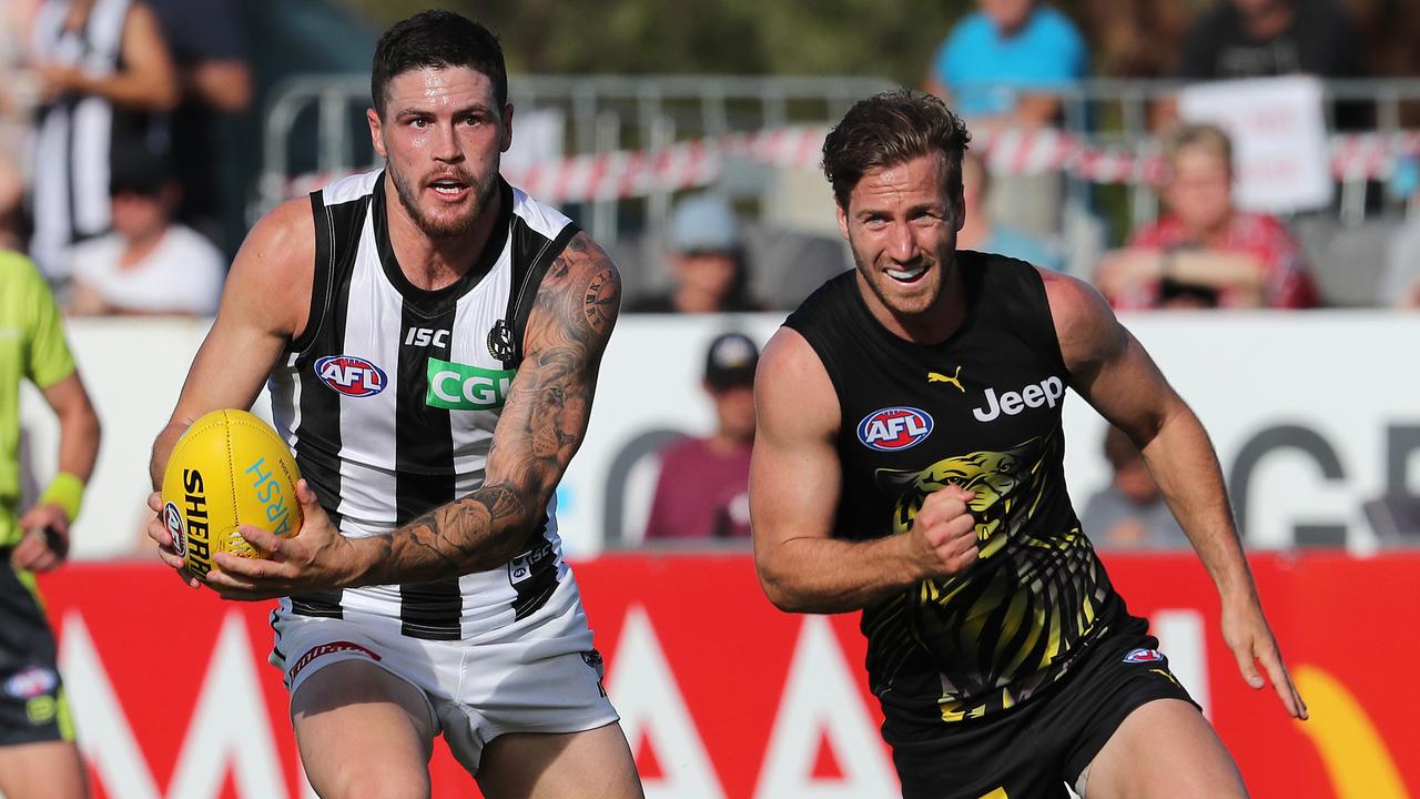 Magpie Jack Crisp leaves Kane Lambert in his wake. Picture: Michael Klein