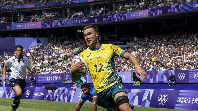 PARIS, FRANCE - JULY 24: Nathan Lawson of the Australia Men's National Team scores a try in a Pool B match against Samoa during day 1 of the Olympic Games Paris 2024 at Stade de France on July 24, 2024 in Paris, France. (Photo by Alex Ho/ISI Photos/Getty Images)