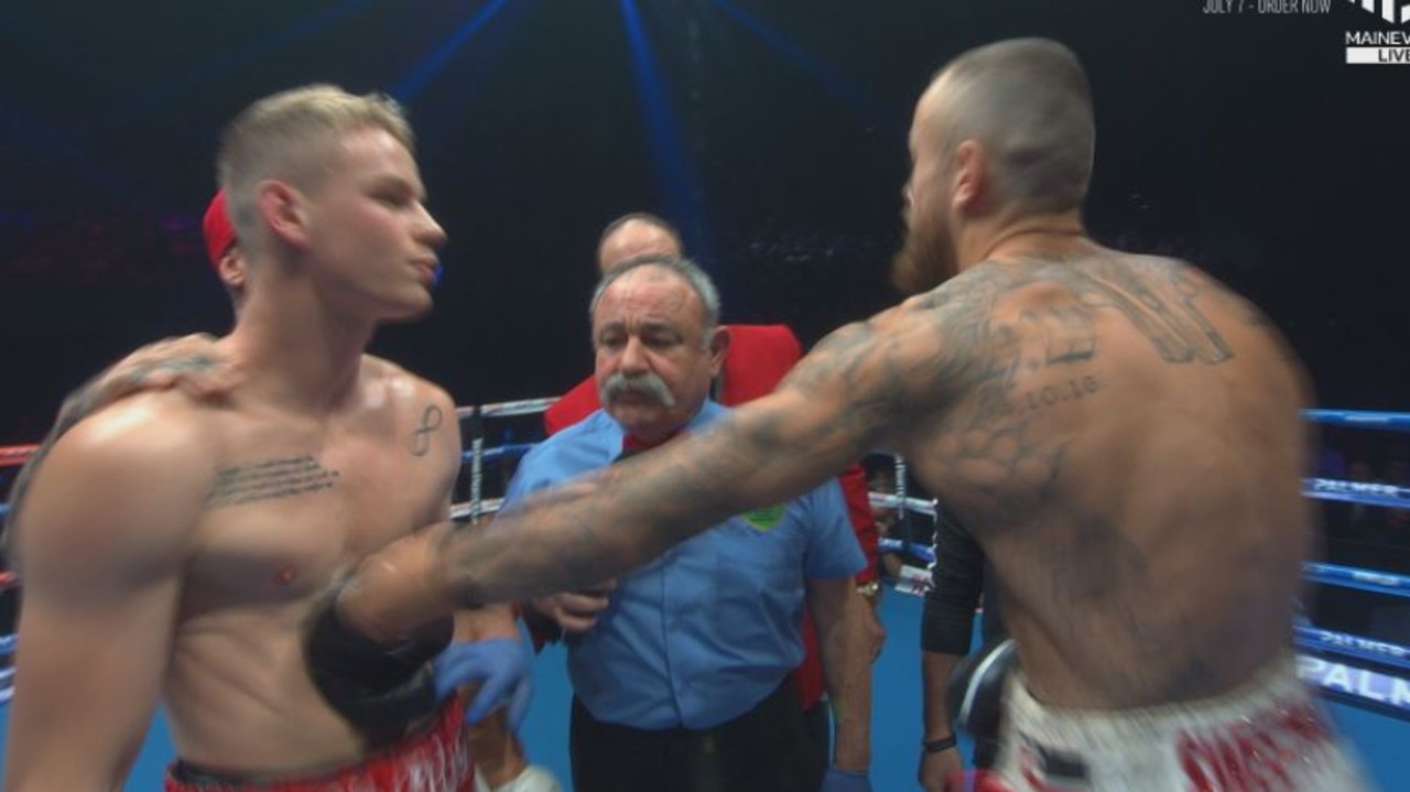 Alex Hanan strikes a blow on Andrei Mikhailovich before the bout begins.
