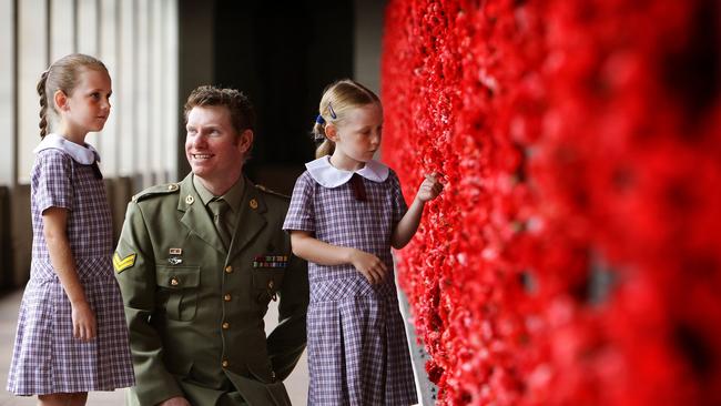 Keighran, who is a member of the Council of the Australian War Memorial, with 8-year-old Isobelle Toohey and 6-year-old Hannah Toohey at the Canberra building.