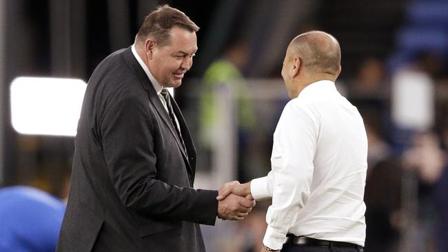 New Zealand coach Steve Hansen, left, and England coach Eddie Jones shake hands on the field before the semi-final. Picture: AP