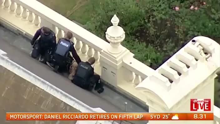 Man arrested on roof of Government House in Melbourne