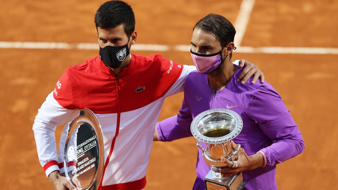 Rafael Nadal of Spain celebrates with the trophy after winning the final over Novak Djokovic of Serbia during the men's final at the Rome Masters.