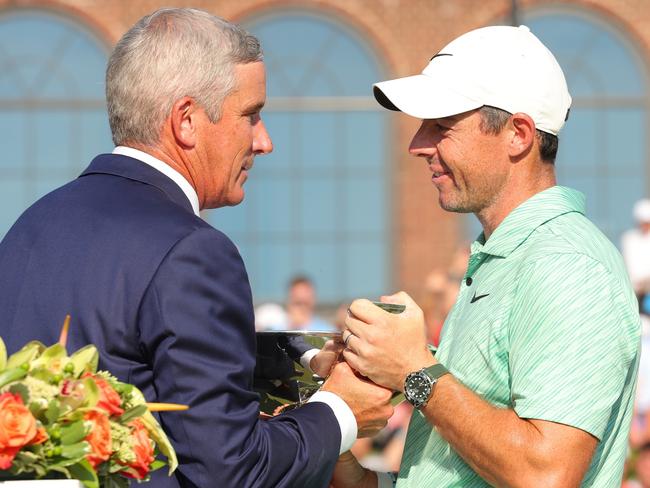 ATLANTA, GEORGIA - AUGUST 28: PGA Tour Commissioner Jay Monahan presents Rory McIlroy of Northern Ireland with the FedEx Cup after McIlroy won during the final round of the TOUR Championship at East Lake Golf Club on August 28, 2022 in Atlanta, Georgia. (Photo by Kevin C. Cox/Getty Images)