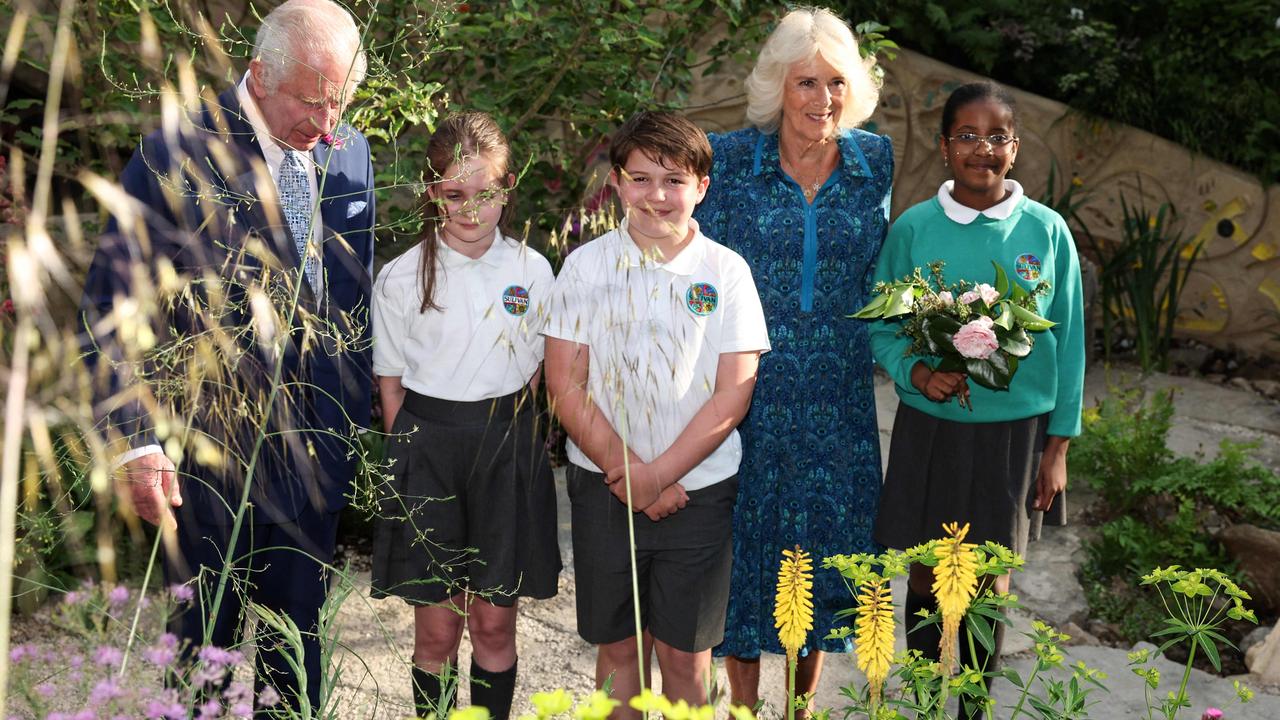 Britain's King Charles III, left, and Queen Camilla, second right, met with Sulivan Primary School pupils while visiting the No Adults Allowed Garden that the children co-designed for the 2024 RHS Chelsea Flower Show in London on May 20. Picture: Adrian Dennis/POOL/AFP