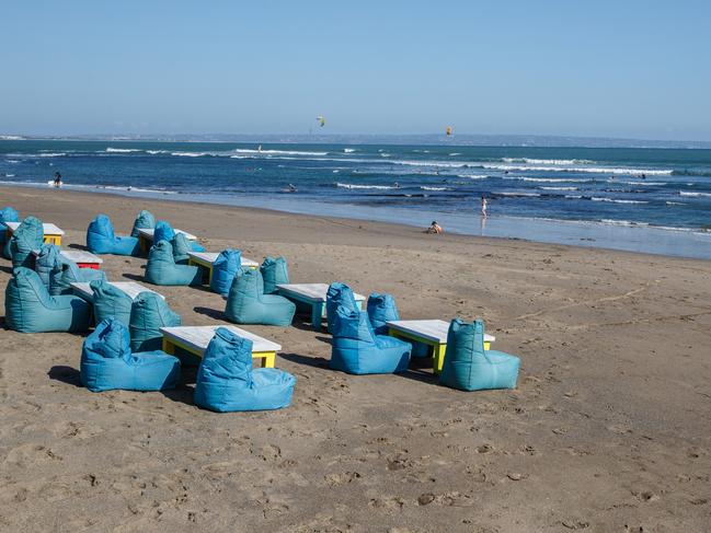 Seating for tourists on Batubolong beach in the Canggu area of Bali, Indonesia, which has reopened to international travellers. Picture: Getty Images