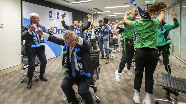 Chris Nikou, Chairman of Football Federation Australia celebrates with Matildas players as FIFA announces the decision. Picture: Getty Images.