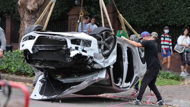 Crew members move a car into position for the scene. Picture: Damian Shaw