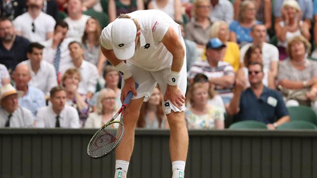 More than six hours on court took its toll on Kevin Anderson. Picture: AFP.