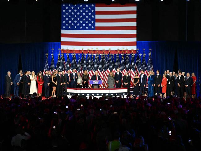 Ivanka Trump, in blue, can be seen to the far right of her father Donald Trump. Picture: AFP.