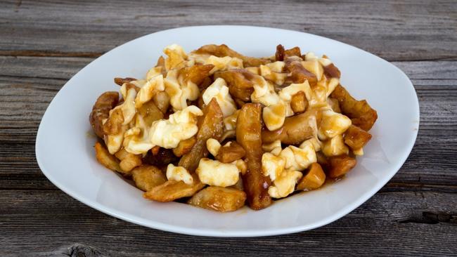 Canada's famously decadent take on hot chips, poutine is decked out with gravy and cheese curd.