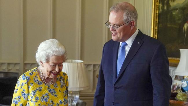 Australian Prime Minister Scott Morrison tells Queen Elizabeth II that she was “quite the hit” with G7 leaders during an audience in the Oak Room at Windsor Castle. Picture: Getty Images