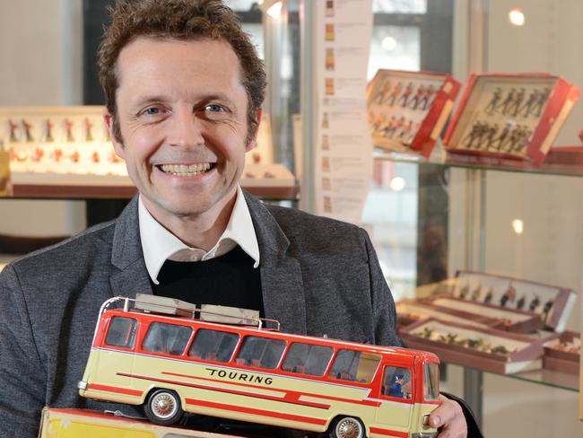 Giles Moon, consultant at Leonard Joel Auction House and Director of Giles Moon Collectibles, pictured holding a collectible 'Joustra' battery operated tinplate French made toy, produced in the 1960's and valued at approx $200. Picture: Jason Sammon