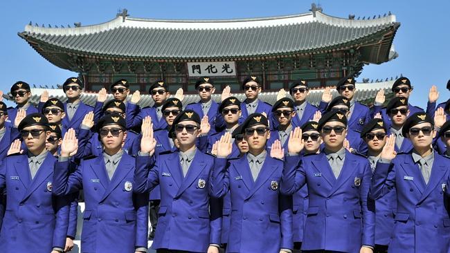 South Korean "tourist police" officers are sworn in during their inauguration ceremony. Picture: AFP