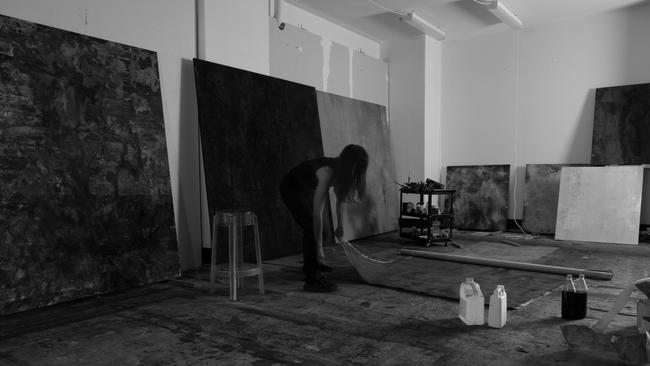 Hasaballah rolling out a work in her Ultimo studio. Picture: Tristan Jensen