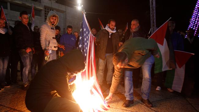 Palestinian demonstrators burn the US flag in Bethlehem's Manger Square in protest to the declaration of the US president declaring Jerusalem as Israel's capital on December 6, 2017. Picture: AFP