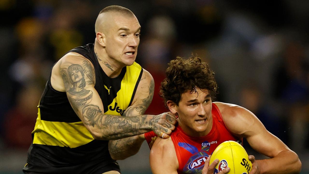 Dustin Martin tackles Gold Coast’s Wil Powell during the Tigers’ shock Round 16 loss at Marvel Stadium. Picture: Getty Images