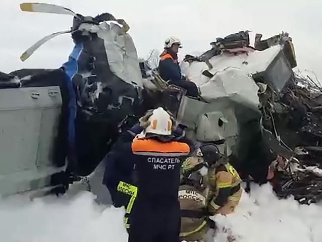 Video-grab image shows rescuers working at the crash site of the L-410 plane crash. Picture: AFP