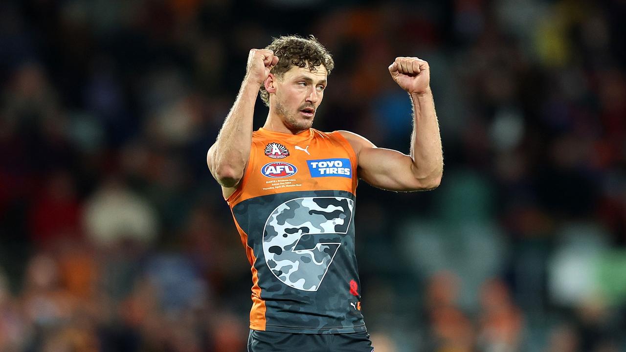 CANBERRA, AUSTRALIA – APRIL 25: Harry Perryman of the Giants celebrates kicking a goal during the round seven AFL match between Greater Western Sydney Giants and Brisbane Lions at Manuka Oval, on April 25, 2024, in Canberra, Australia. (Photo by Mark Metcalfe/AFL Photos/via Getty Images )