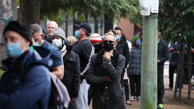 People line up to receive theiir Covid vaccination at a Sydney Covid-19 hub. Picture: Getty