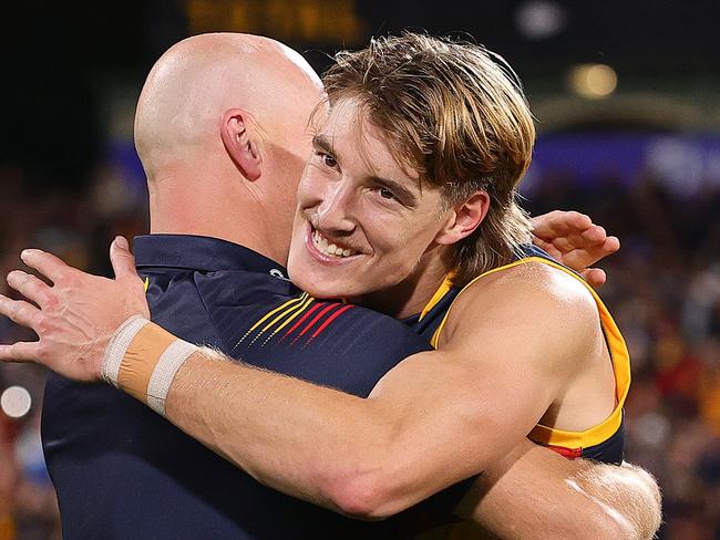 ADELAIDE, AUSTRALIA - MAY 02: Matthew Nicks, Senior Coach of the Crows embraces Josh Worrell of the Crows after the win during the 2024 AFL Round 08 match between the Adelaide Crows and the Port Adelaide Power at Adelaide Oval on May 02, 2024 in Adelaide, Australia. (Photo by Sarah Reed/AFL Photos via Getty Images)