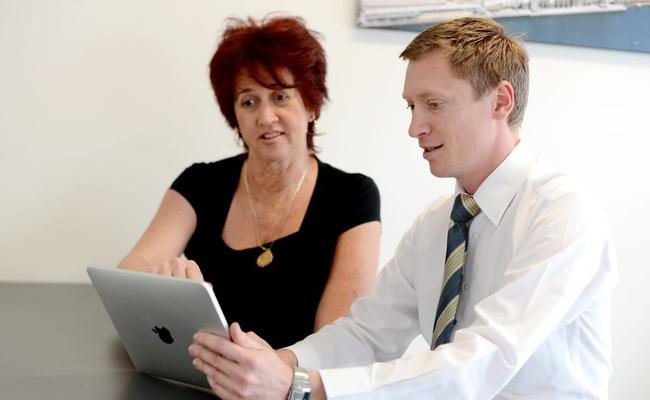 Julie Wood and Andrew Allen using technology to sell houses. Ray White, Gladstone. . Picture: Brenda Strong