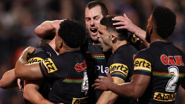 PENRITH, AUSTRALIA - SEPTEMBER 13: Luke Garner of the Panthers celebrates scoring a try with Paul Alamoti, Isaah Yeo and Nathan Cleary of the Panthers during the NRL Qualifying Final match between Penrith Panthers and Sydney Roosters at BlueBet Stadium on September 13, 2024 in Penrith, Australia. (Photo by Cameron Spencer/Getty Images)