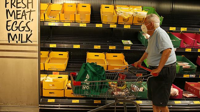 A shopper looks at the near empty chicken section at Aldi Supermarket Edgecliff. Items at the supermarket are jumping in price, as producers grapple with increasing input costs. Picture: Jane Dempster