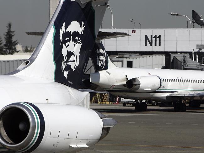 (FILES) This file photo taken on September 25, 2006 shows Alaska Airlines planes at Seattle-Tacoma International Airport. Alaska Airlines parent company Alaska Air Group said on April 4, 2016 it was acquiring Virgin America in a friendly takeover worth around $4 billion including debt to create the US's fifth-largest airline.A definitive merger agreement had been unanimously approved by the boards of both companies, it said in a statement. / AFP PHOTO / GABRIEL BOUYS