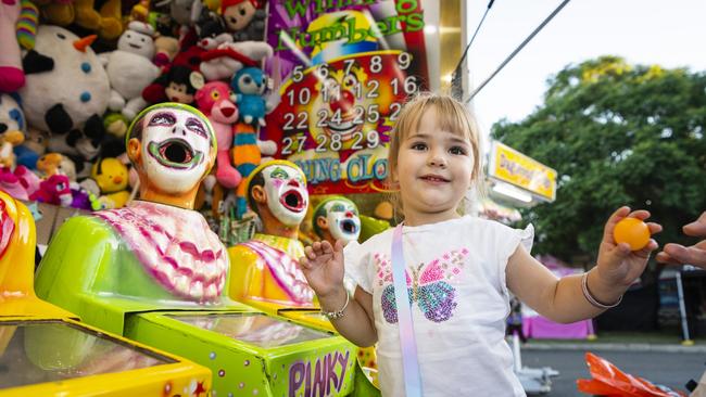 Ruby-Jane Hopper, 3, plays in sideshow alley at the Toowoomba Royal Show, Thursday, March 30, 2023. Picture: Kevin Farmer