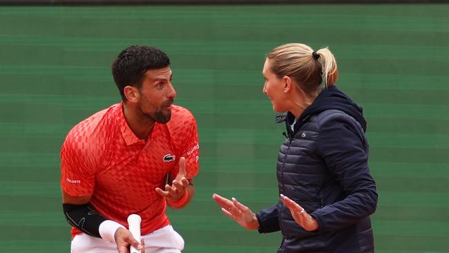 Novak Djokovic of Serbia argues with the chair umpire Aurelie Tourte. (Photo by Clive Brunskill/Getty Images)