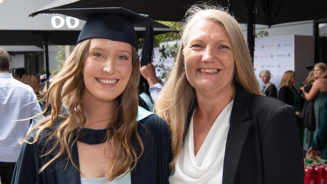 Madeleine and Simone Wright celebrate graduation. Picture: Brad Fleet