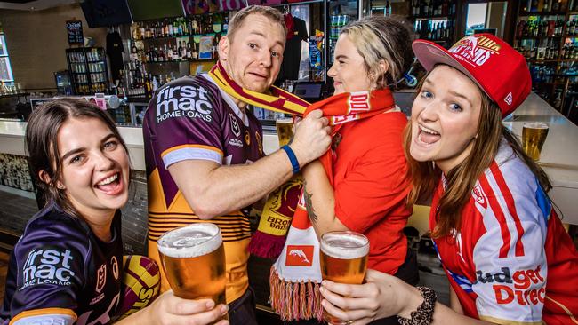 Caxton Hotel staff gearing up for the Broncos v Dolphins game on Friday night are Georgie Hull, Stirling Farquhar (Broncos), Kenny Biggs and Amelia Ford (Dolphins). Picture: Nigel Hallett