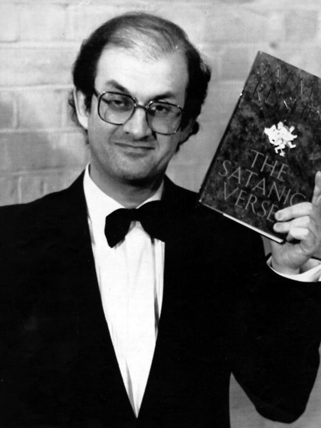 Salamn Rushdie holding his book The Satanic Verses in 1989. Picture: AP