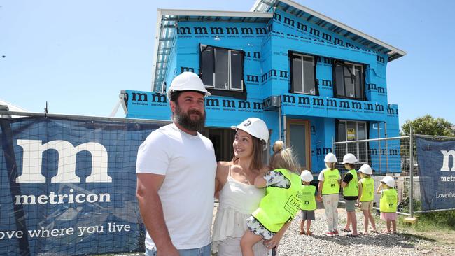 Danielle and Rhys Carroll check out progress on their new home while it was under construction. Picture: Glenn Hampson.