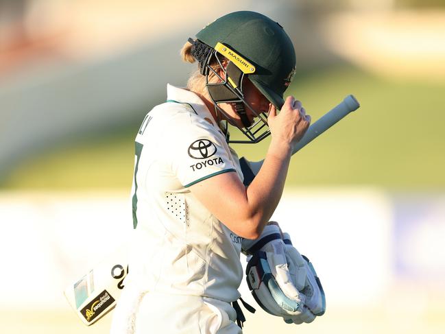 PERTH, AUSTRALIA - FEBRUARY 15: Alyssa Healy of Australia walks from the field after being dismissed for 99 by Delmi Tucker of South Africa during day one of the Women's Test Match between Australia and South Africa at the WACA on February 15, 2024 in Perth, Australia. (Photo by Paul Kane/Getty Images)