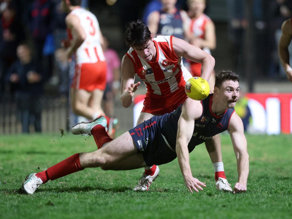 Norwood's Harry Boyd dives for the ball against North Adelaide at Norwood Oval in Round 18. Picture: Cory Sutton.