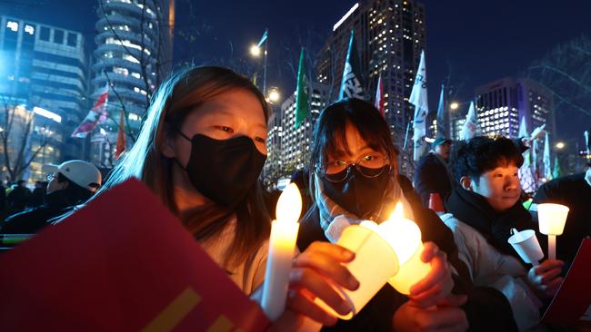 South Korean protesters demonstrate against the country's president after politicians voted to lift the declaration of emergency martial law announced earlier by President Yoon Suk Yeol. Picture: Chung Sung-Jun/Getty Images