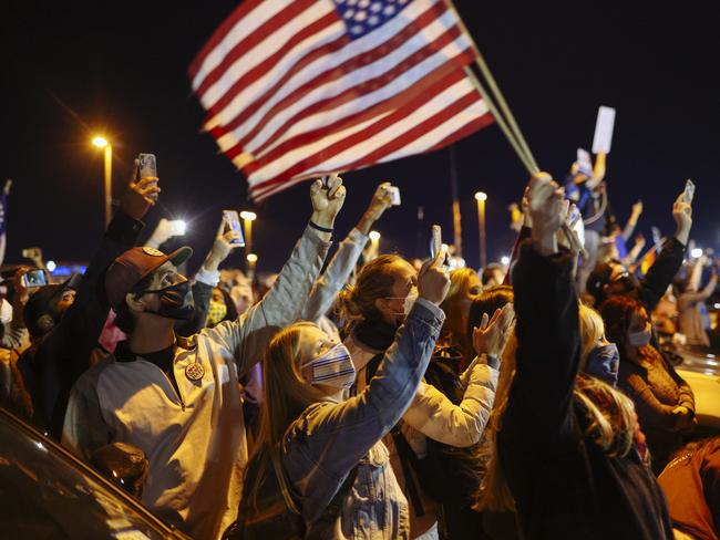 Joe Biden’s supporters cheered him on, wearing masks. Picture: Angus Mordant