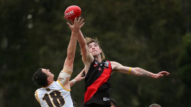 NFL: Eltham v Thomastown: Finnbar Maley of Eltham (R) contest ruck against Jarryd Coulson of Thomastown on Saturday May 14, 2022, in Eltham, Australia.Picture: Hamish Blair