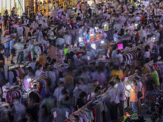 Street vendors sell clothes at an outdoor market in Wuhan, China. Picture: AFP