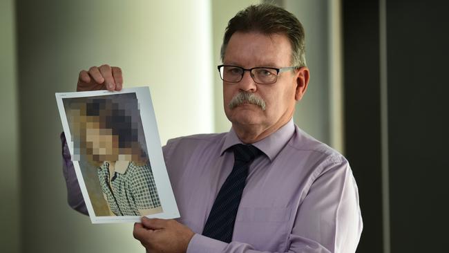 Head of the Sexual Crimes Squad Detective Inspector Steve Wilson with a photograph of the victim. Picture: Tony Gough